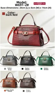 Detail view of stylish croc-embossed handbags in multiple colors with metallic logo