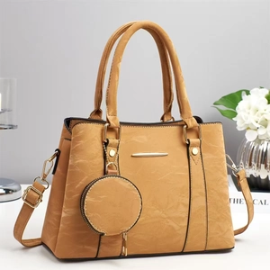 Elegant khaki faux leather handbag with gold hardware and a small round coin purse charm