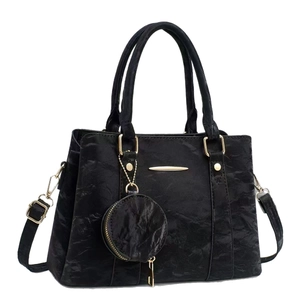 Elegant black pleated handbag with gold accents and a small round coin pouch for women