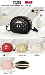 Three-layer quilted crossbody bag with flamingo detail and multiple zip compartments
