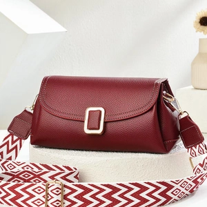 Burgundy litchi leather crossbody bag with golden square buckle and geometric jacquard strap