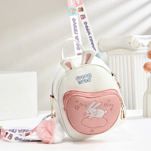 Detail of cute rabbit ear backpack for girls with embroidery and heart-shaped pocket