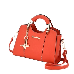Elegante borsa a mano arancione da donna con manico dorato e ciondolo a stella