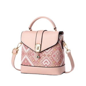 Pink floral printed mini crossbody bag with leather trim and bear-shaped metal clasp