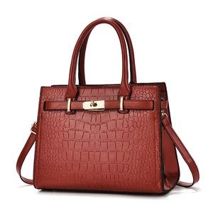 Elegant reddish brown crocodile texture tote bag with gold lock and shoulder strap