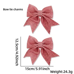Pink glitter Christmas bow set showing dimensions 15x12.5cm for holiday tree decoration