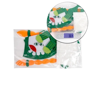 DIY St. Patrick's Day felt decoration kit with shamrocks and gold coins in packaging