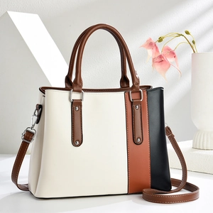 Three-color patchwork leather tote bag with top handles and adjustable shoulder strap