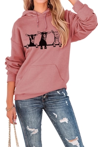 Close-up of pink oversized hoodie featuring three sheep print and a kangaroo pocket