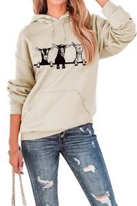 Close-up of three goat graphics and kangaroo pocket on beige loose-fit hoodie
