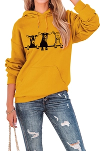 Detail of yellow oversized hoodie featuring black and white hand-drawn goat print design