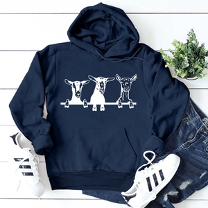 Close-up of sheep graphic print on a navy blue oversized hoodie for women