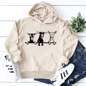 Detailed close-up of beige heavy cotton hoodie featuring three goats graphic print
