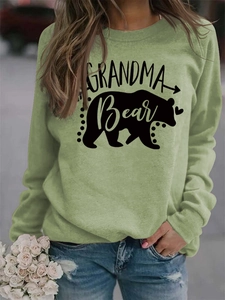 Detail of Grandma Bear print and bear silhouette on sage green long sleeve sweatshirt