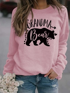 Detail of the grandma bear graphic print on a pink long sleeve sweatshirt