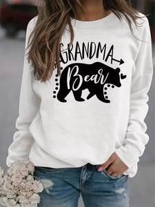 Detailed close-up of Grandma Bear letter print and bear silhouette on white sweatshirt