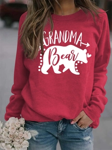 Detail of red Grandma Bear sweatshirt with white letter print and bear silhouette