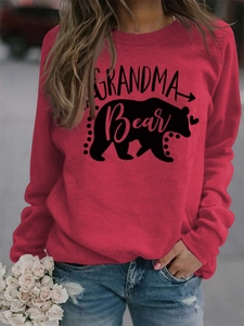 Detail of red Grandma Bear sweatshirt with black bear print and heart graphic