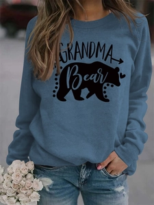 Detail view of Grandma Bear print and bear silhouette on blue long sleeve sweatshirt
