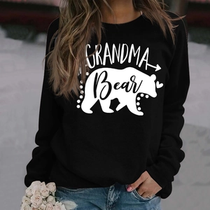 Detail of Grandma Bear white graphic print on a black long sleeve crewneck sweatshirt