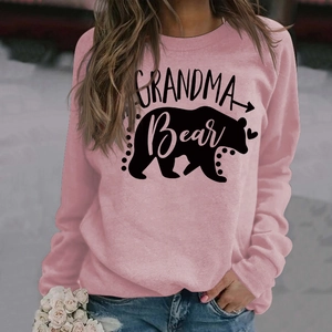 Detail of Grandma Bear print and heart graphic on pink long sleeve crewneck sweatshirt
