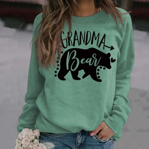 Detail of Grandma Bear print on mint green long sleeve sweatshirt with outdoor vibe
