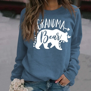 Close-up of Grandma Bear letter print and bear silhouette on blue long-sleeve sweatshirt