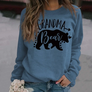 Detailed view of Grandma Bear letter print and black bear silhouette on blue sweatshirt
