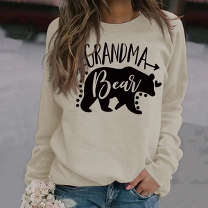 Detail of Grandma Bear letter print on a beige long sleeve crewneck sweatshirt