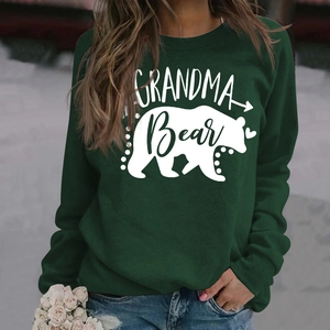 Detail of Grandma Bear print on dark green long sleeve sweatshirt with heart graphics
