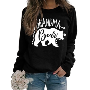 Detail of Grandma Bear print on black long sleeve sweatshirt with heart and arrow motifs