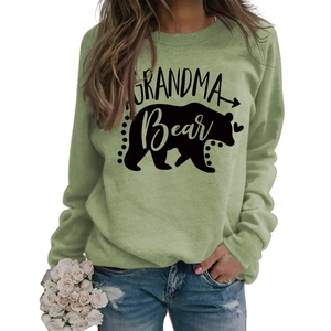 Detail of sage green Grandma Bear printed sweatshirt with soft cotton fabric texture