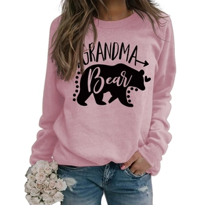 Detailed view of pink Grandma Bear sweatshirt with black bear graphic and lettering