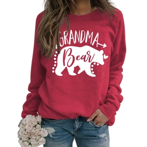 Detail of red Grandma Bear sweatshirt featuring white polar bear silhouette and soft fabric