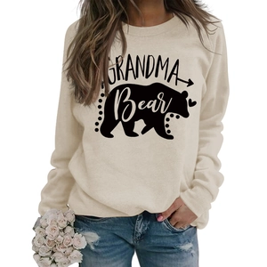 Close-up of Grandma Bear print and bear silhouette on beige long sleeve sweatshirt