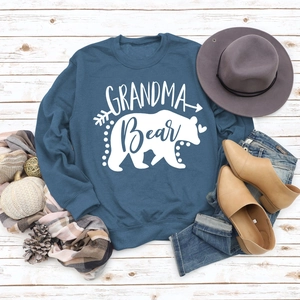 Navy Grandma Bear sweatshirt flat lay with autumn boots, hat and seasonal decor