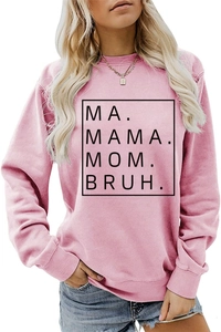 Close-up of pink crewneck sweatshirt featuring MA MAMA MOM BRUH text and ribbed cuffs
