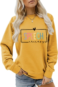 Detail of Speech Therapy colorful print on mustard yellow long sleeve sweatshirt