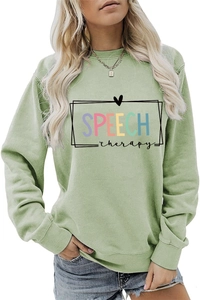 Detail view of colorful Speech Therapy lettering printed on light green crewneck sweatshirt