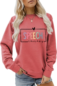 Close-up of multicolor SPEECH therapy print and ribbed cuffs on brick red sweatshirt