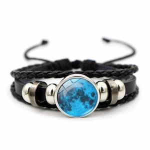 Detail view of multi-layer braided moon planet bead bracelet with adjustable cord