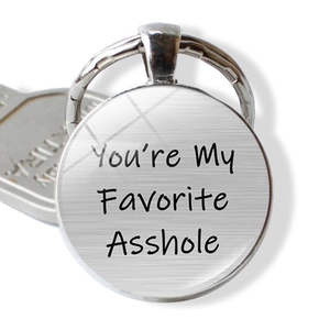 Close-up of funny You're My Favorite Asshole engraved keyring in brushed stainless steel