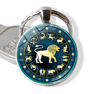 Detail of Leo zodiac glass keychain with golden lion design and roman numerals