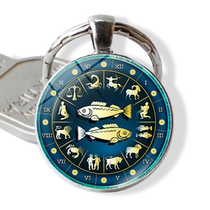 Pisces zodiac keychain with glass cabochon and blue starry sky constellations design