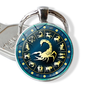 Silver Scorpio zodiac keychain with blue star glass dome and gold scorpion symbol