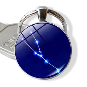 Blue Taurus constellation keychain with glass dome and durable metal ring pendant