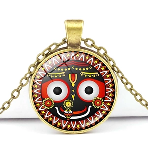 Vintage Hindu Lord Jagannath glass dome necklace with antique bronze metal pendant