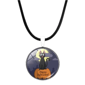 Close-up of Halloween pendant with black cat and pumpkin under moon on leather cord