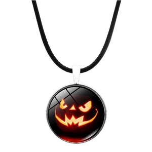 Macro detail of Halloween necklace featuring a glowing pumpkin glass pendant on leather cord