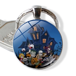 Detail of Halloween keychain pendant with cartoon pumpkin and ghost illustrations